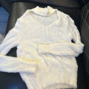Size medium fuzzy sweater. Worn once and in great condition